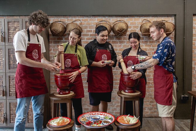 Authentic Thai Cooking with the Largest market visit &TukTuk ride - Your guide matters: Chef Pim, Chef Alex, and how their teaching style helps