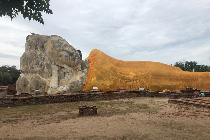 Ayutthaya Day Tour By Coach and Cruise - Wat Lokayasutharam (Temple of the Reclining Buddha): big, dramatic, and worth slowing down for