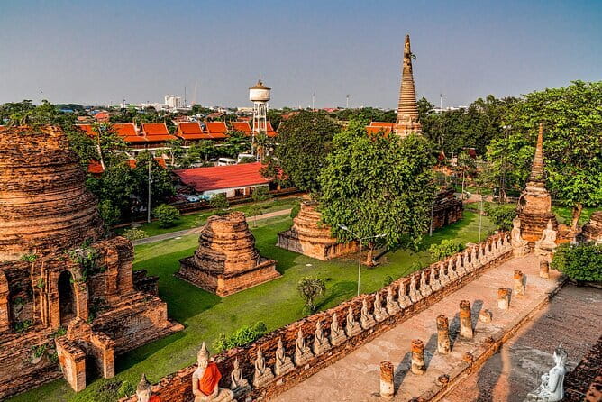 Ayutthaya Glittering from Bangkok with Heritage Sunset Cruise - The 100-Year-Old Heritage Cruise: Thai Dance, Umbrella Photos, and Food Timing
