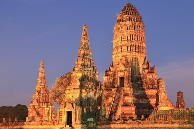 Ayutthaya Heritage Join City Tour with Sunset Boat Ride - Bangkok - Wat Yai Chai Mongkol: stupa views and the reclining Buddha moment