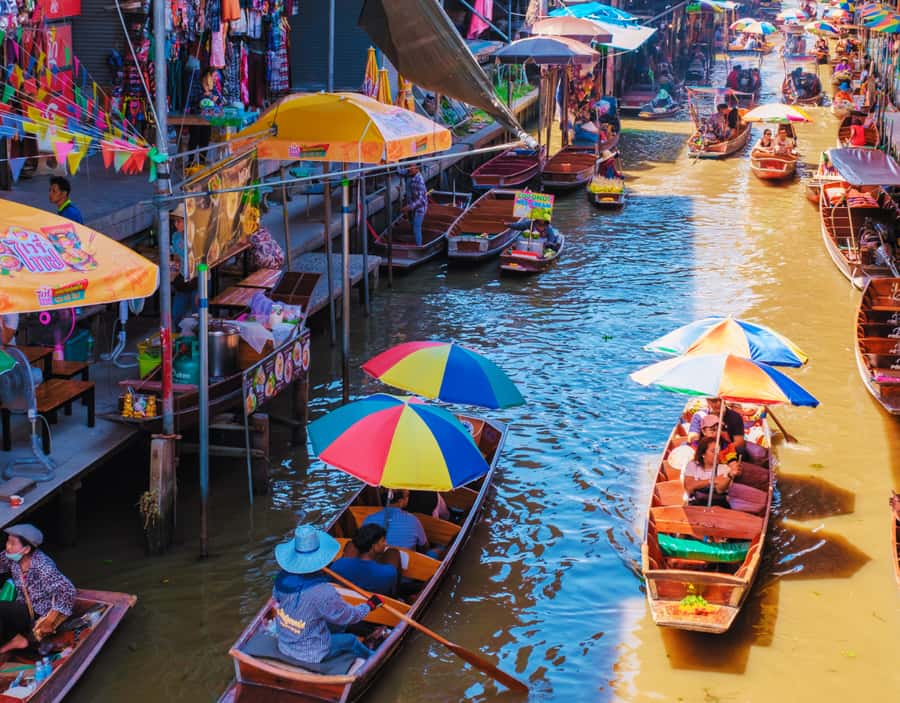 Bangkok: Amphawa Floating & Railway Markets Guided Day Tour - When the guide adds extras like Temple in the Trees and a coconut farm