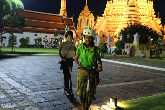 Bangkok at Night by Electric Scooter - Wat Arun at night and the ferry moment you should time for photos