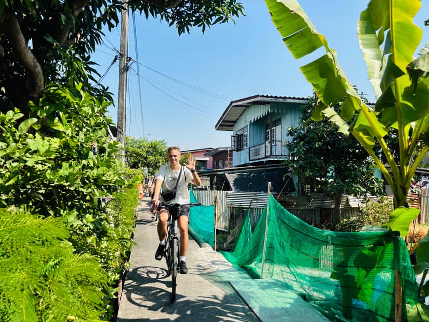 Bangkok: Backstreets and Hidden Gems Bike Tour - Winding canal riding and the tall Buddha you can see from the water