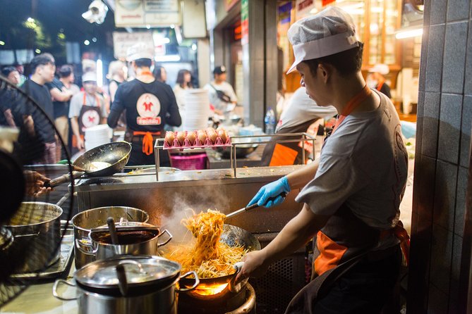 Bangkok by Night: Temples, Markets and Food Tuk-Tuk Tour - Wongwian Yai street food sampling: snack time with a guide