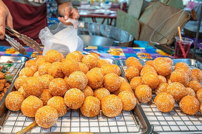 Bangkok Evening Food Tour by Tuktuk - Market food and satay skewers: the kind of stop you plan the whole trip around