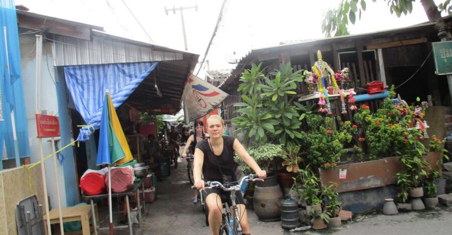 Bangkok Full-Day Bike Tour with Boat Transfer and Lunch - Tropical fruit, highway-under communities, and everyday Bangkok scenes