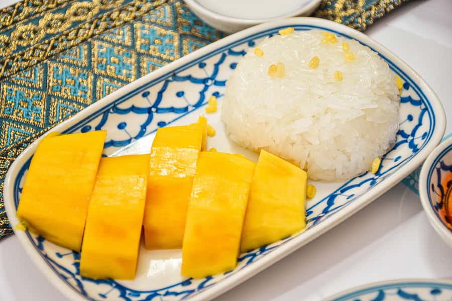 Bangkok: Grand Palace, Wat Pho with Mango Dessert Tastings - Wat Pho: reclining Buddha, 1,000 Buddha images, and Thai massage origins