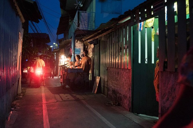 Bangkok Hidden Paths Night Biking Tour with Street-food Meal - Near the Grand Palace area: temple etiquette without the daytime crowds