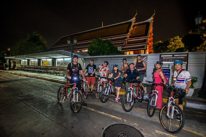 Bangkok: Night Bike Tour with Temples & Flower Market Visit - Wat Rakang Kositaram: A Temple Stop With Quiet Contrast