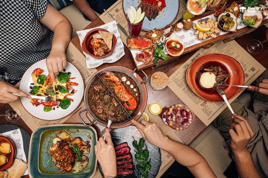 Bangkok: UNO MAS at Centara Grand Central World - Spanish dishes you should expect: tapas, seafood paella, and table-prep moments