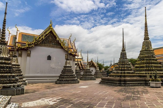 Cultural Treasures of Bangkok: Temples & Royal Palace Tour - The Grand Palace grounds: classical Thai architecture and royal rules