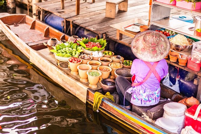 Damnoen Saduak Floating Market and Maeklong Railway Market Tour - Maeklong Railway Market (Talad Rom Hoop): seeing umbrellas and awnings close fast