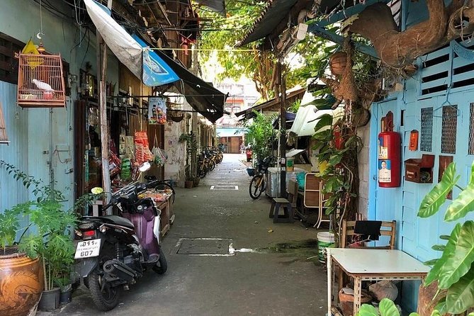 Experience Real Bangkok by Bike - Temple Moments and Lotus-Peeling at a Local Stop