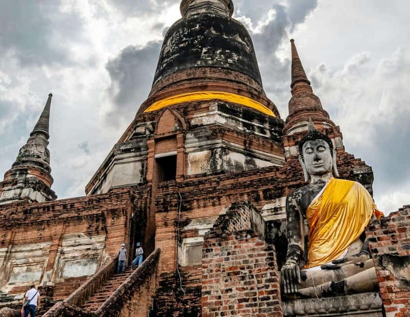 From Bangkok: Ayutthaya Heritage Tour with Sunset Boat Ride - Wat Yai Chai Mongkhon, chedi scale and a reclining Buddha moment