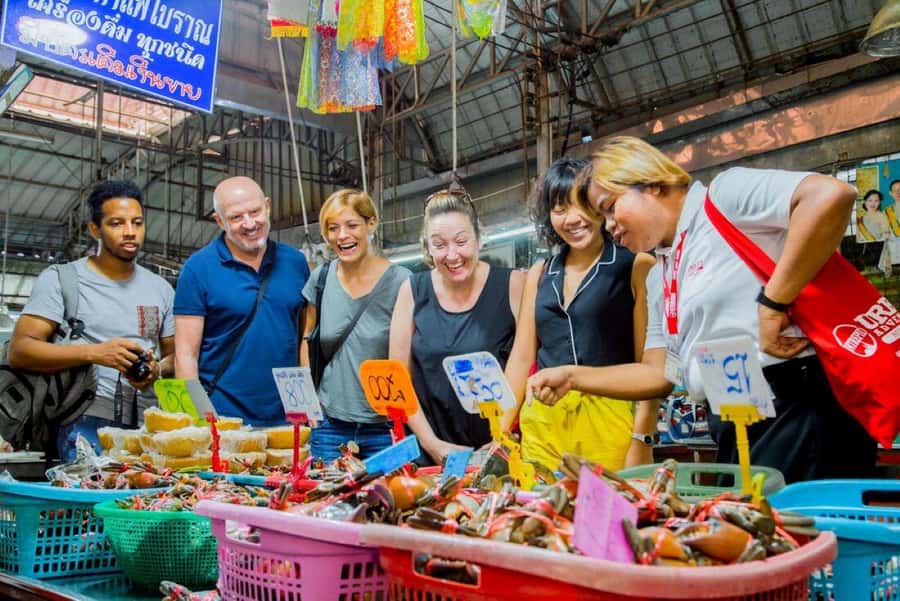 From Bangkok: Private Railway and Floating Market Tour - Entering the railway market where the tracks are part of the shopping