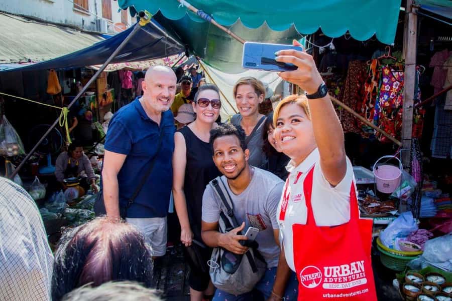 From Bangkok: Private Railway and Floating Market Tour - What the train-through-market moment looks like up close
