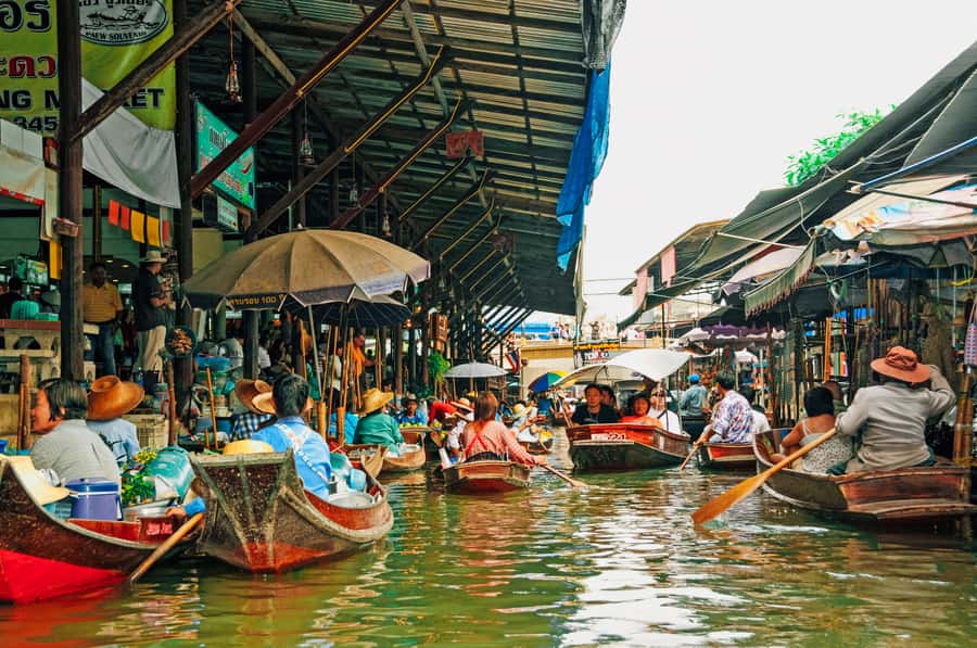 Grand Palace, Damnoen Floating Market & Maeklong Market Tour - Maeklong Railway Market: Talat Rom Hup and the moving target moment