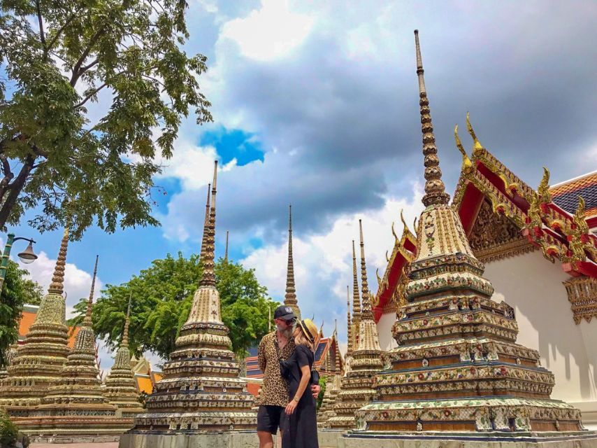 Grand Palace, Wat Pho, and Wat Arun: Guided Tour in Spanish - Wat Arun, the Temple of Dawn, and the porcelain-tile skyline