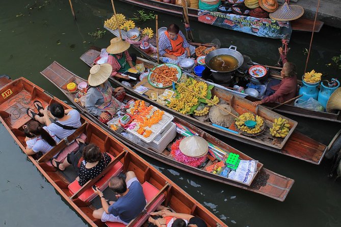Half-Day Railway Market and Floating Market Tour in Thailand - Damnoen Saduak Floating Market: longtail boat cruising through canal life