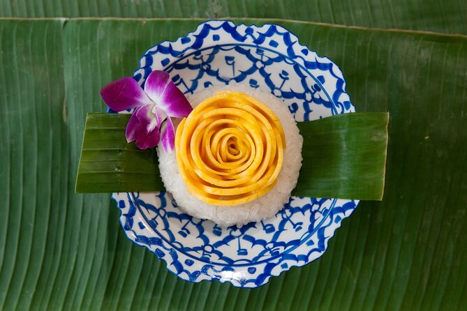 Hands-on Thai Cooking Class & Market Tour in Sukhumvit - Meet the chef and instructors: April and Peach get noticed