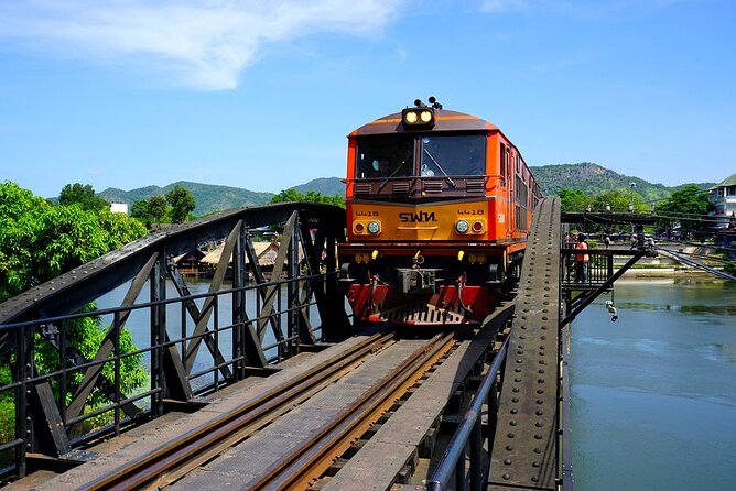 Kanchanaburi Full Day Tour: River Kwai and Erawan Falls - River Kwai Bridge crossing, boat ride, and a working railway feel