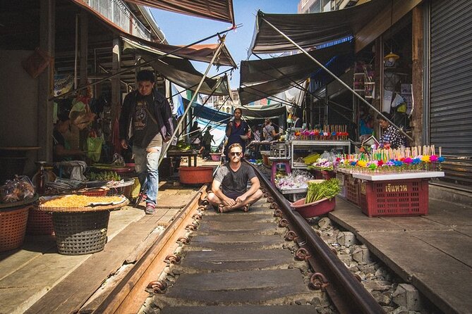 Maeklong Railway Market and Damnoen Saduak Floating Market Tour From Bangkok - Damnoen Saduak itself: browsing plus snack sampling by the canal