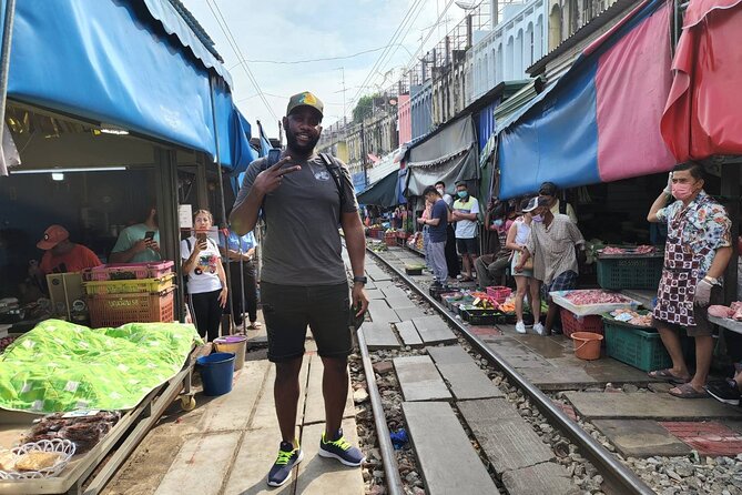Private Amphawa & Maeklong Railway Market Day Tour with Fireflies - Mae Klong Railway Market: the train passes, and the market reacts