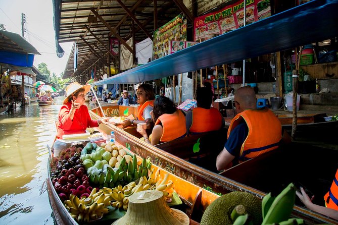 Private Tour from Bangkok: Railway and Floating Markets Tour - What the train moment feels like in the middle of the stalls