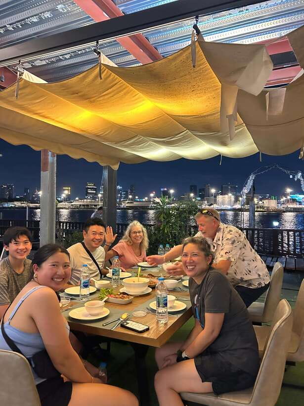 Twilight Firefly Bangkok Bicycle Tour - Dinner with Bangkok’s skyline glowing across the river